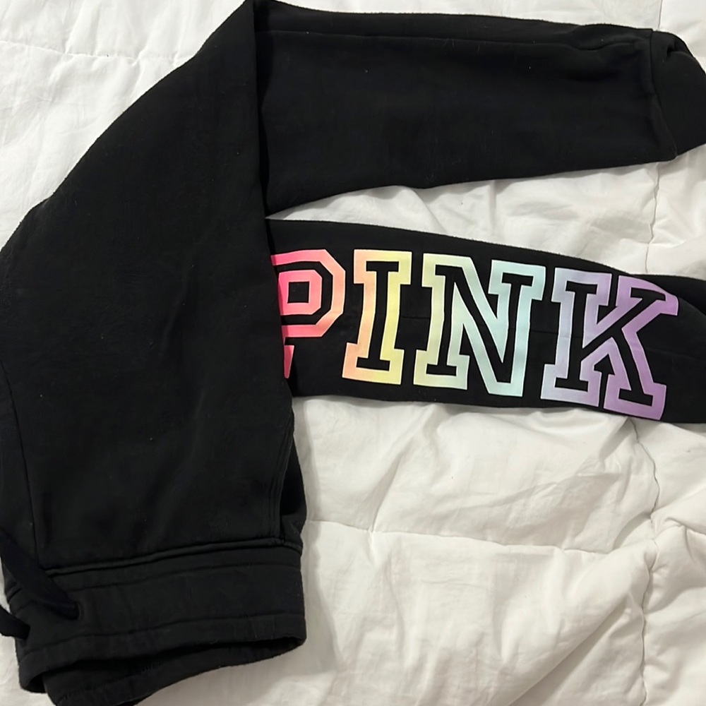 pink black joggers. has pockets